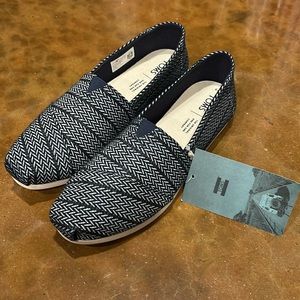 Brand new Toms classic slip on shoes in Navy Herringbone
